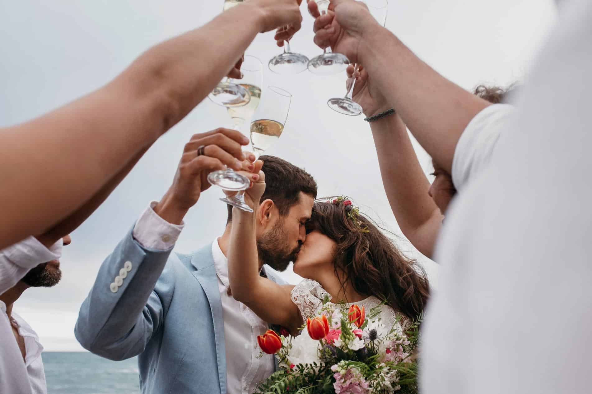 People Celebrating With Their Friends Getting Married Beach